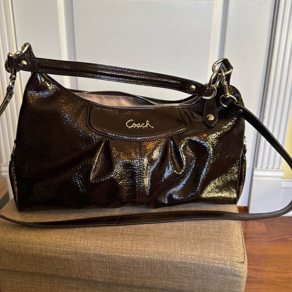 Coach brown patent cross-body or shoulder bag.  Tan satin lining.